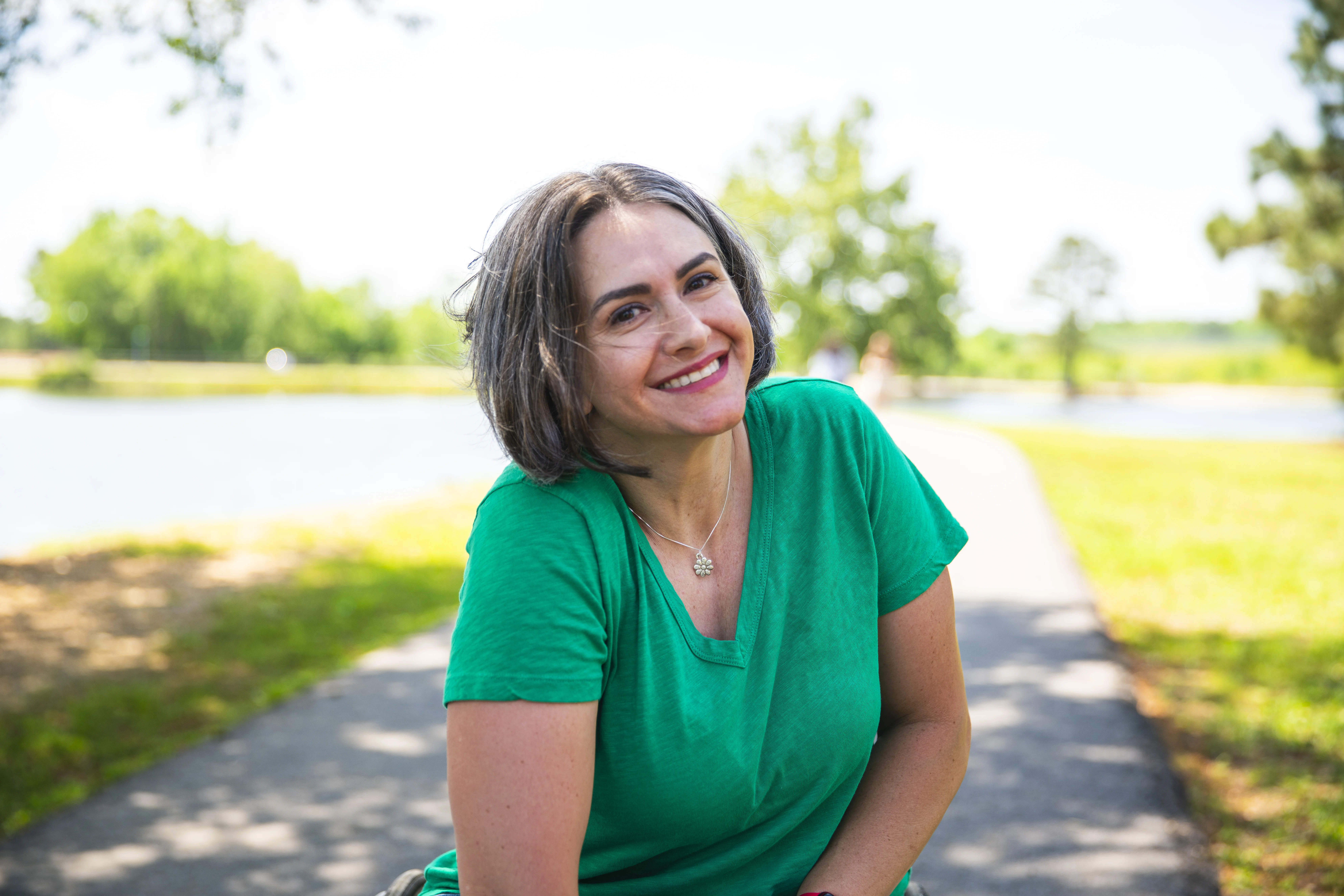a woman sitting on a path