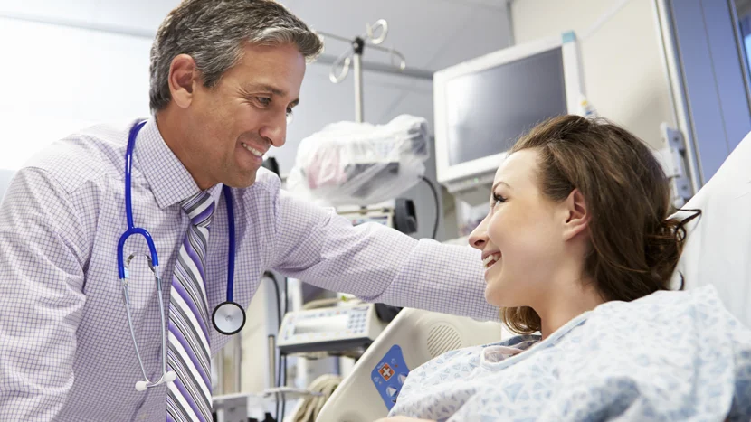 a doctor speaking to a patient