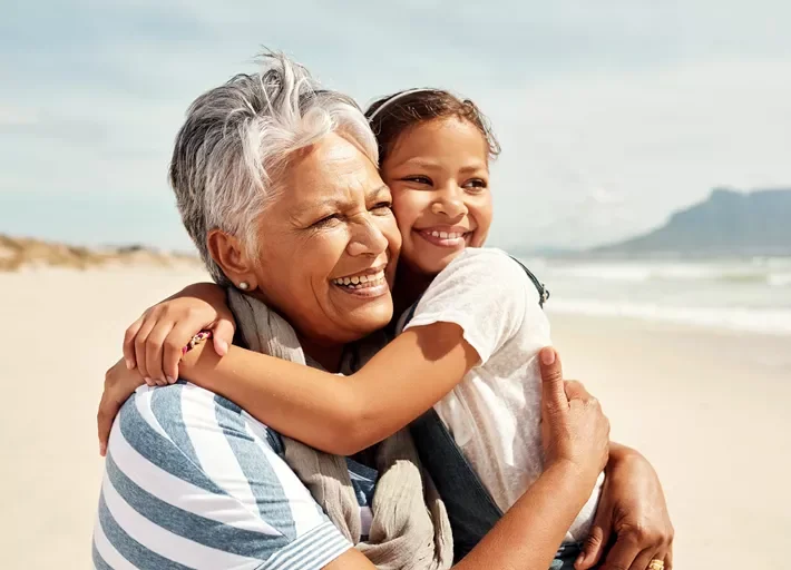 woman and girl hugging 